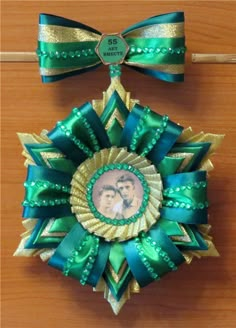 an ornament made out of ribbon with a photo in the center on it