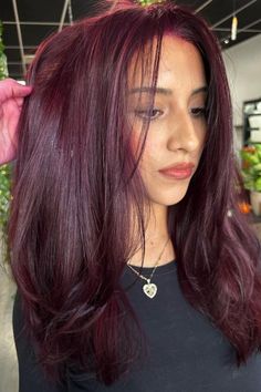 Looking to spice up your hair game? Dark red hair is the perfect way to add a bold and sultry touch to your look. 💋 #darkredhair #hairinspo #boldbeauty #sultryvibes #hairgoals #redhot 🔥 Whether you opt for a deep burgundy or a fiery auburn, this color is sure to turn heads and make a statement. 💁‍♀️ #statementhair #hairtransformation Don't be afraid to go dark and embrace your inner vixen with dark red hair. 💄 #vixenvibes #haircolor #confidenceboost #beauty #hairtrends Ashy Burgandy Hair, Wine Red And Purple Hair, Cool Tone Burgundy Hair, Burgundy Hair With Brown, Burgundy Magenta Hair, Bellami Mulberry Wine Hair, Burgundy Hair With Lowlights, Cherry Red Hair On Pale Skin, Mohagni Hair Color