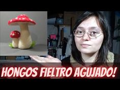 a woman is holding her hand out in front of a fake mushroom and the words, ho