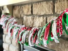 the garlands are hanging on the brick wall