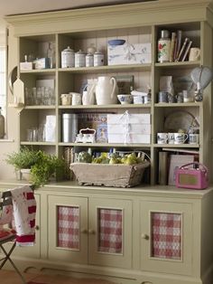 an old china cabinet is filled with dishes