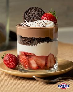 a dessert with chocolate, strawberries and cream