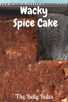 a close up of a piece of cake on a plate with the words wacky spice cake