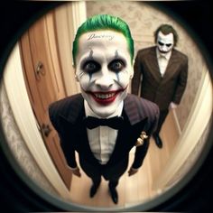 a man in a suit and green hair is looking through a mirror at another person dressed as the joker