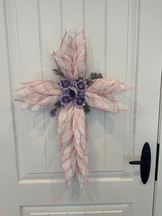 a white door with a pink and purple flower on it