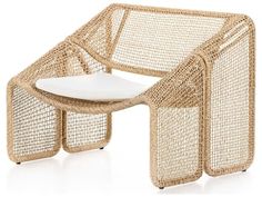 a wicker chair with a white cushion on it