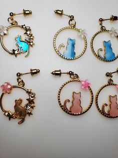 Cat themed gold tone drop/dangle earrings.  Sure to delight the cat lover in your life! Made in a smoke free, pet friendly environment. Cat Themed, Blue Back, Cat Necklace, Drop Dangle Earrings, Cat Sitting, Cat Earrings, Cat Theme, Matching Necklaces, Kitty Cat