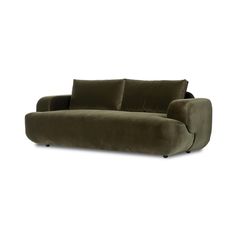 an olive green velvet sofa with two pillows on the back and one arm folded up