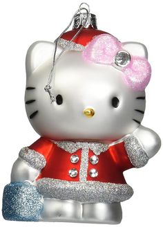 a hello kitty ornament hanging from a christmas tree with glitters on it