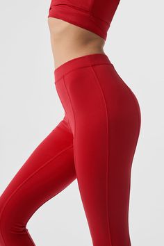 So sleek & powerful. With elevated seam detailing down the center legs, the High-Waist Enso Legging fits just right in smoothing performance Airbrush. The waist-cinching skinny waistband and so-forward toe hook makes this a secure, fitted choice for Pilates and more. Sculpting & smoothing Airbrush Waist-cinching skinny waistband Designed & uniquely fit to flatter every size Wear-tested by our in-house team for the perfect fit Compressive Red Sporty Pants, Red Compressive Sporty Pants, Sporty Compressive Red Pants, Red Compressive Full-length Bottoms, Alo Yoga High Stretch High Waist Bottoms, Red Elastane Athleisure Bottoms, Red Compressive Elastane Leggings, Red Athleisure Bottoms In Elastane, High Stretch High Waist Red Pants