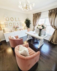 a living room filled with furniture and a chandelier