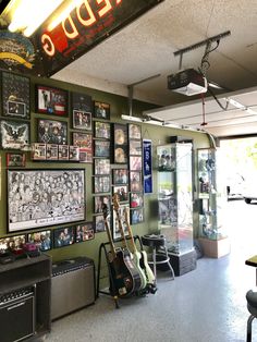 the inside of a music store with guitars and amps