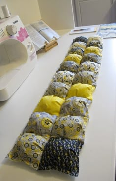 several pillows are lined up on the counter