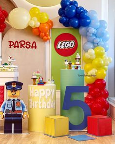 a birthday party with legos and balloons