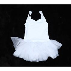 a white tutu dress on a black background