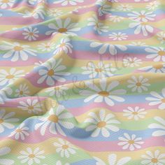 an image of a colorful flower pattern on a fabric background with white and yellow flowers