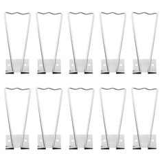 twelve pieces of metal clothes pins on white background