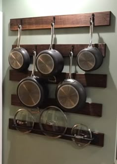 pots and pans are hanging on the wall