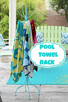 an outdoor pool towel rack with towels hanging from it's sides and the words pool towel rack above it