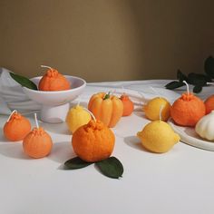 oranges and lemons are arranged on a table