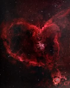 a heart shaped object in the middle of space