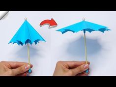 someone is holding two paper umbrellas in their hands, one blue and the other red