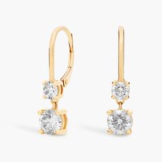 Add a luxurious touch to your look with these stately drop earrings. Each earring features two round-cut diamonds set in lustrous 14k yellow gold for a simple look that is utterly sophisticated. Simple Look, Double Diamond, Diamond Drops, Blue Nile, Diamond Drop Earrings, Diamond Fashion, Round Cut Diamond, Fashion Earrings, Round Cut