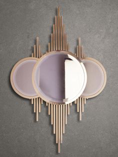 a mirror that is sitting on top of a wall next to some plates and spoons