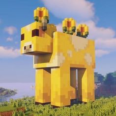 an animal made out of lego blocks in the middle of a field with grass and flowers