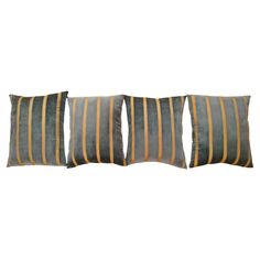 three grey and yellow striped pillows on a white background