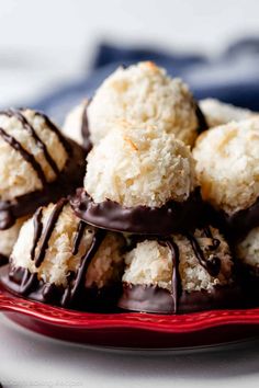 chocolate covered coconut balls on a red plate