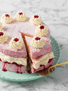 a cake that has been cut into pieces and is on a plate with a fork