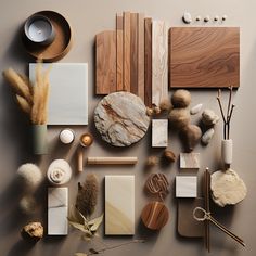 various materials are arranged on a table with wood, stone and other things to make it look like an art project