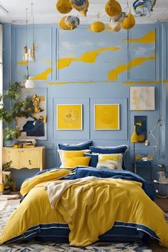 a bedroom with blue walls, yellow and white bedding and paintings on the wall