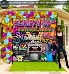 a woman standing in front of a birthday backdrop