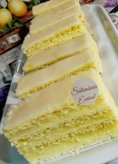 a white plate topped with slices of cake next to a box of lemonades