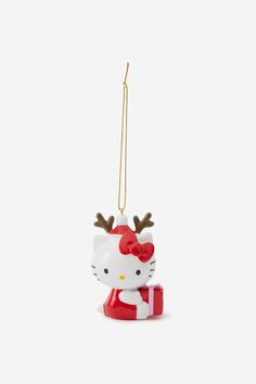 a hello kitty ornament hanging from a string