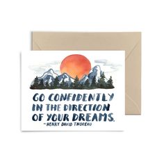 a card with the words go confidently in the direction of your dreams on it and mountains