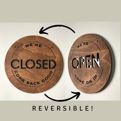 two wooden coasters with the words closed and open printed on them