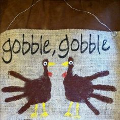 a handprinted sign with two turkeys and the words gobble gobble