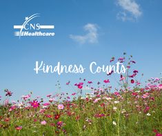 a field full of pink and white flowers with the words kindness counts in front of it