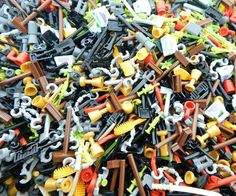 a pile of assorted plastic toy parts