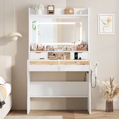 there is a white vanity with two drawers and a mirror on the wall above it