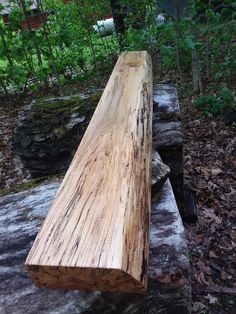 a wooden bench sitting on top of a tree stump