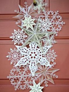 an ornament hanging from the side of a door decorated with snowflakes