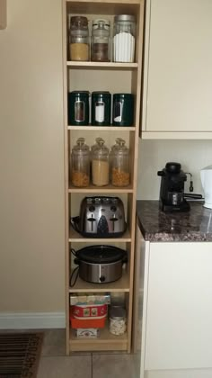 the shelves in the kitchen are filled with pots, pans and other food items