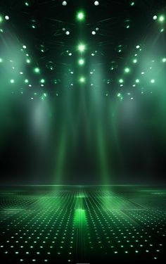 an empty stage with green lights and disco lights on the ceiling, as if for a show or party