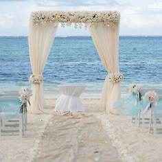 an outdoor wedding setup on the beach