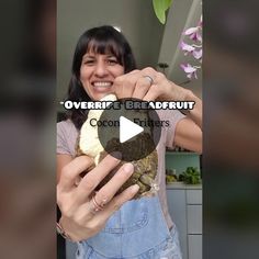 a woman holding an object in her hands with the words overripe's breadfruit on it