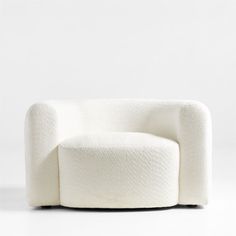 a white chair sitting on top of a white floor